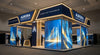 A glowing, professionally designed trade show booth with backlit modular displays stands out in a convention hall, projecting a polished, enterprise-level brand presence.
